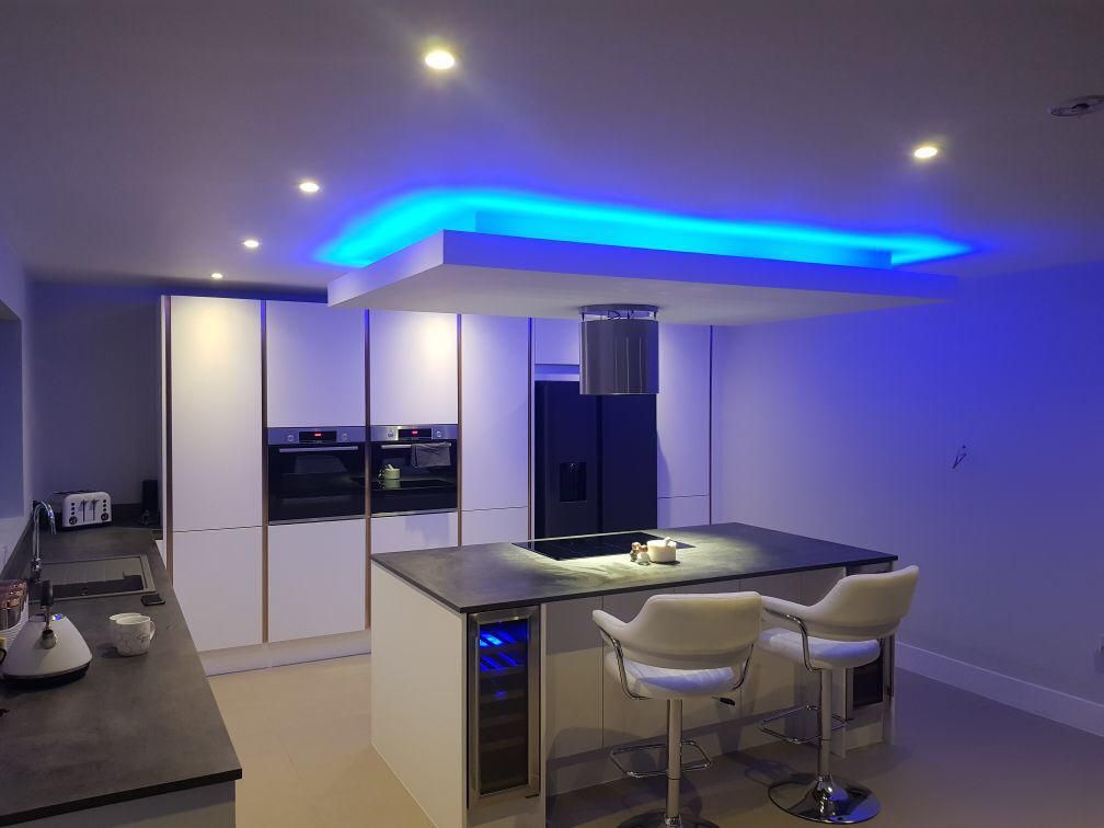 Kitchen with blue LED ceiling feature and downlights